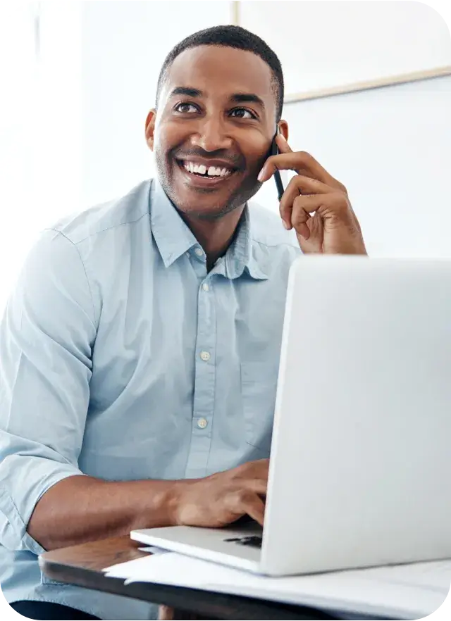 Man sitting behind a laptop