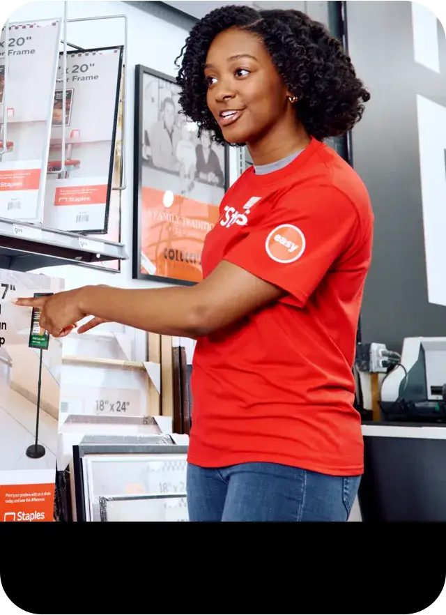 woman pointing to an item on the shelf