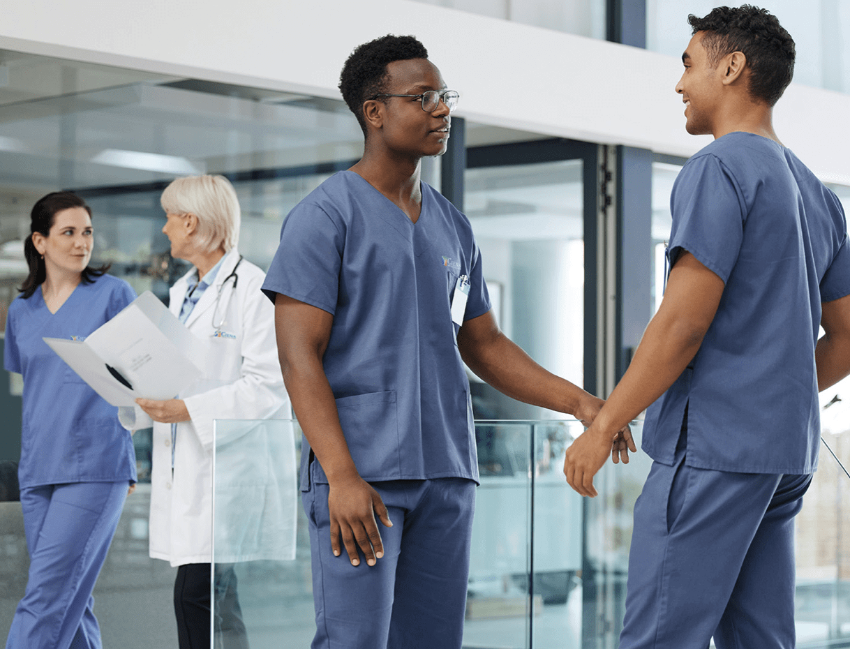 Healthcare professionals talking in a hospital hallway