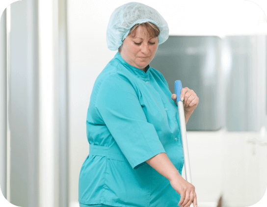 Woman in scrubs, mopping floor