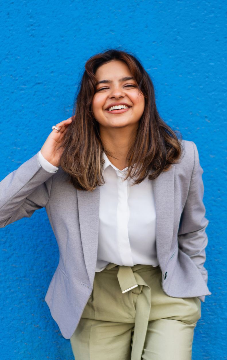 Student in blazer smiling