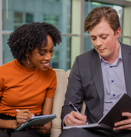 Two students discussing work