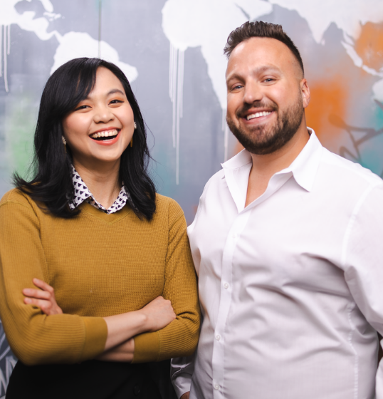 Two students smiling together