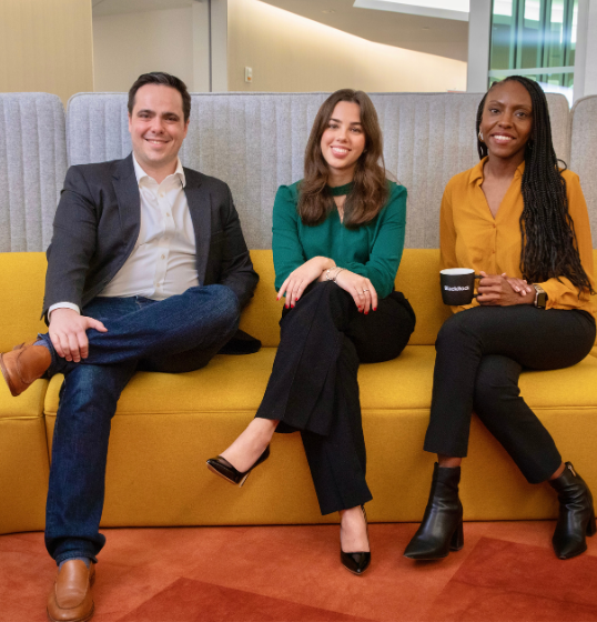 BlackRock employees on yellow couch