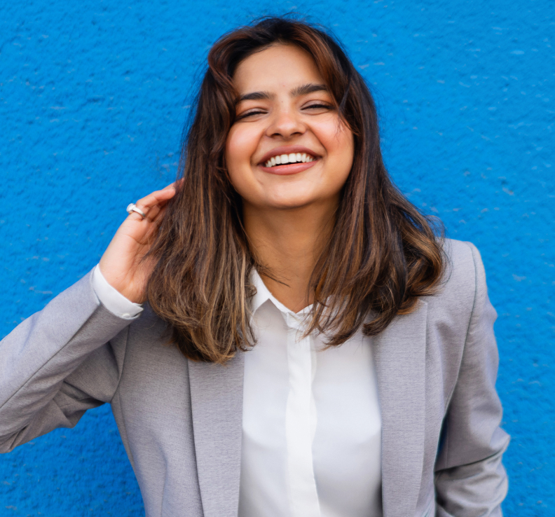 Student in blazer smiling