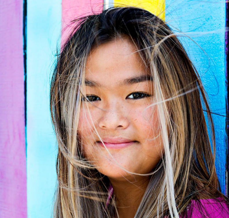 Student in front of colorful background