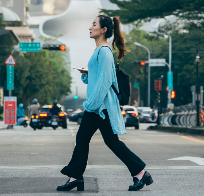 Student crossing busy street