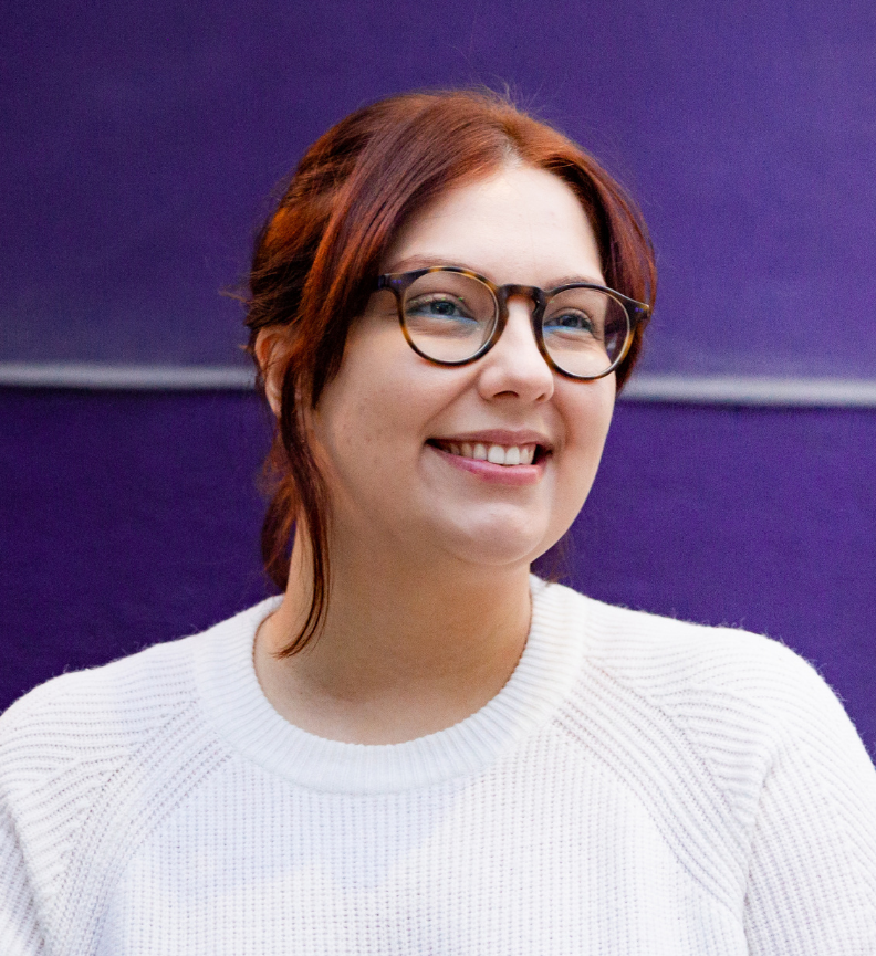 Student in front of purple wall