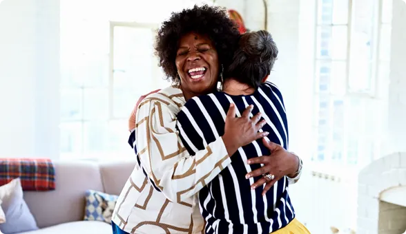 Two women hugging