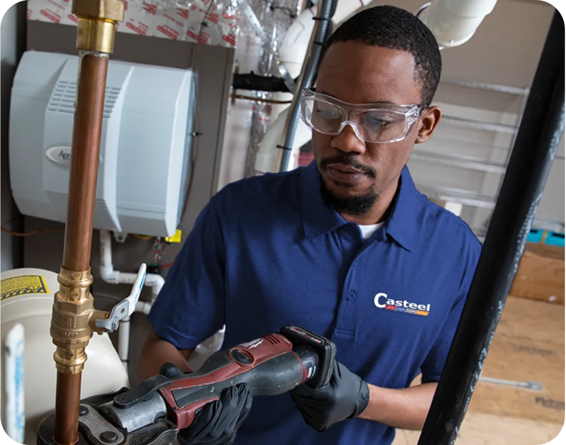 Technician working on copper pipe