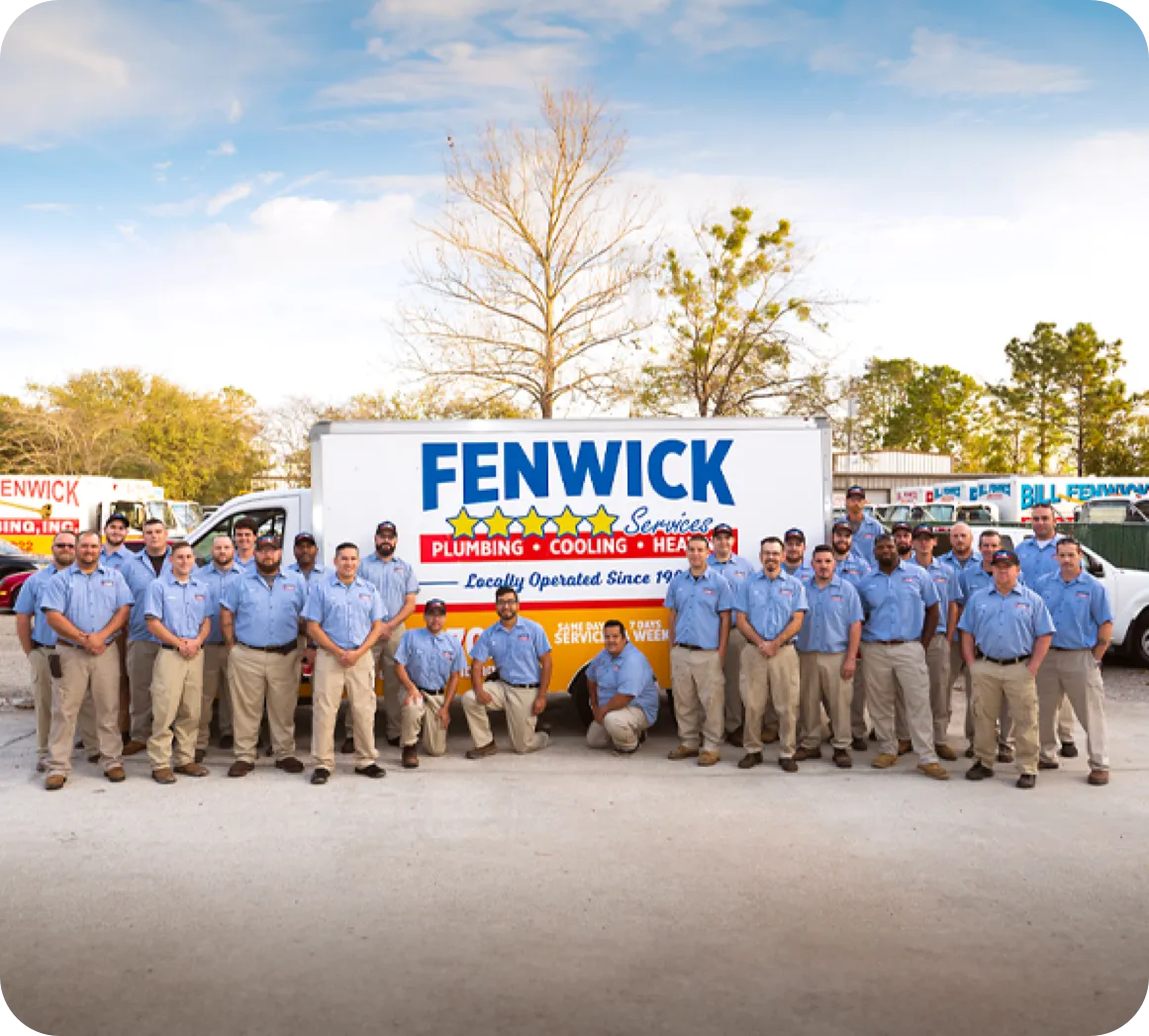 Employees smiling for the camera holding a trophy belt