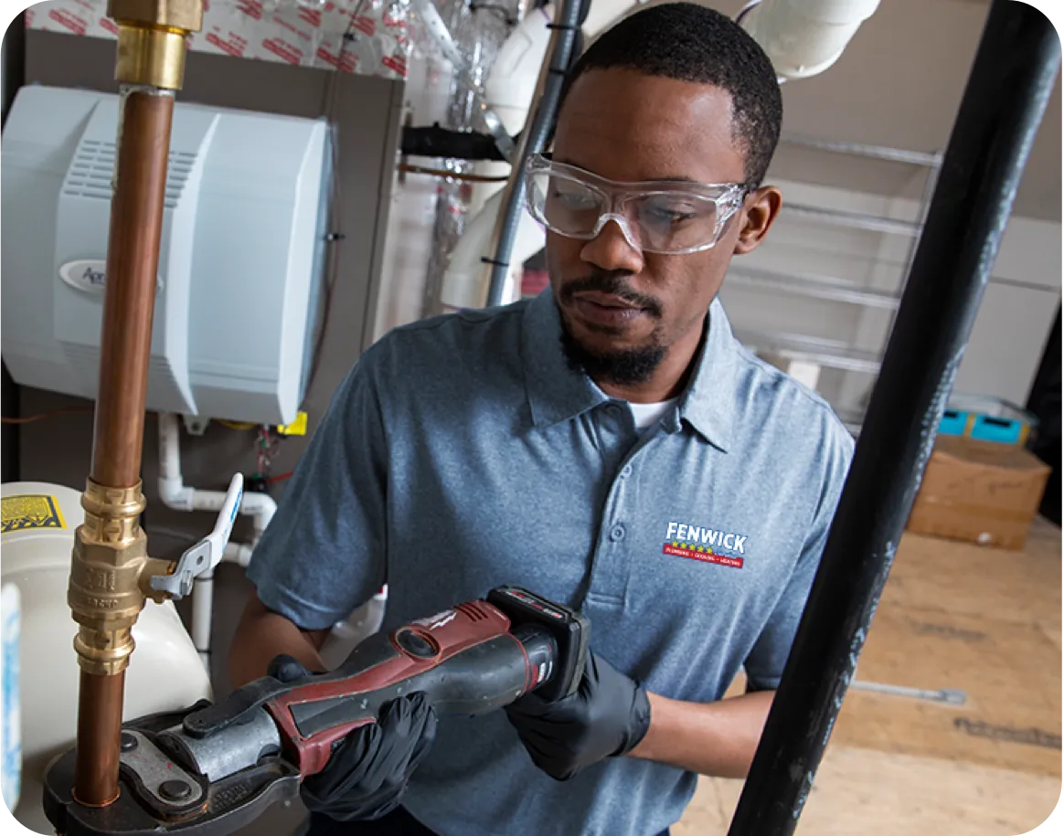 Technician working on copper pipe