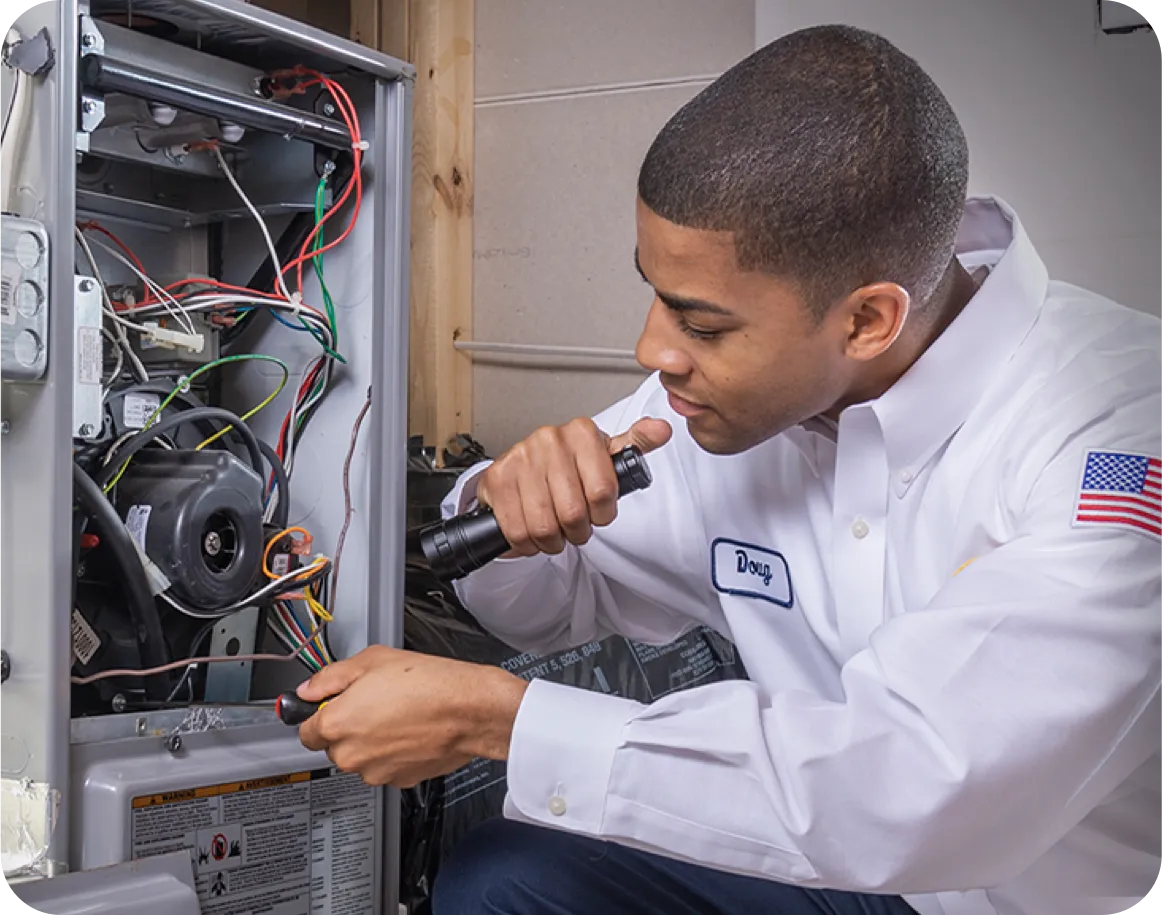 Technician working on an HVAC unit.