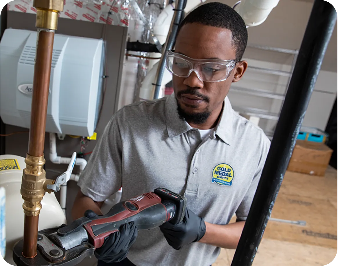 Technician working on copper pipe