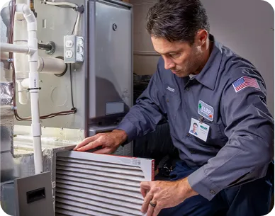 Technician working on an HVAC unit.