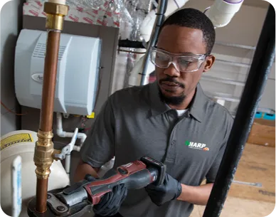 Technician working on copper pipe