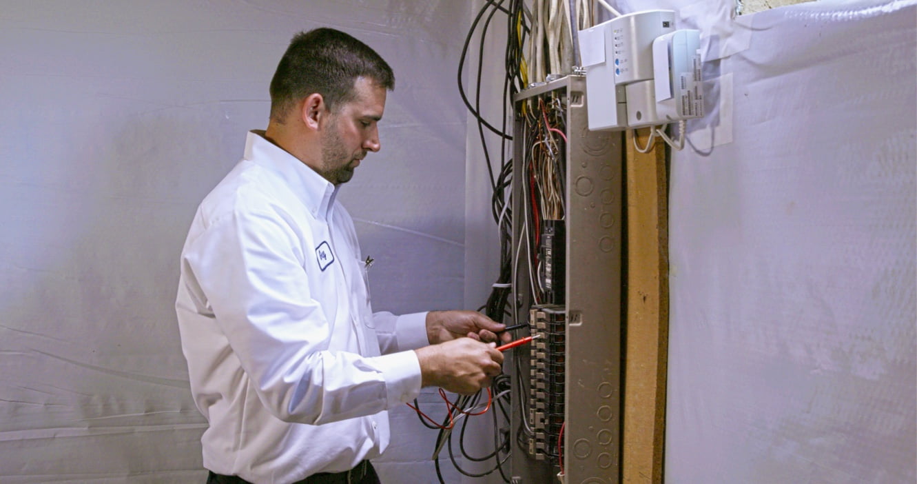 Technician working on an electrical panel.