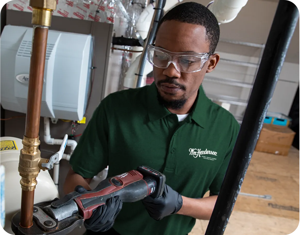 Technician working on copper pipe