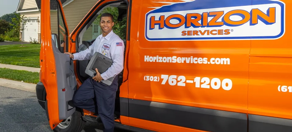 Technician getting out of a work van