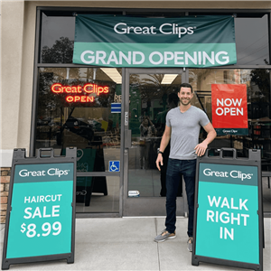Great Clips franchisee, Drew Jacobs, standing in front of salon.