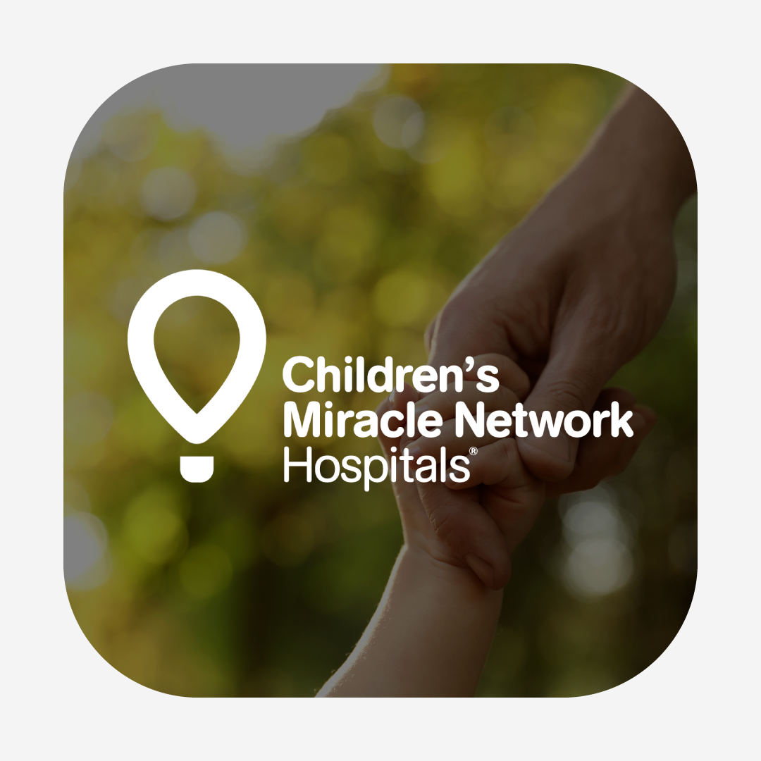 Children's Miracle Network logo over a closeup image of a child's hand holding an adult's hand.