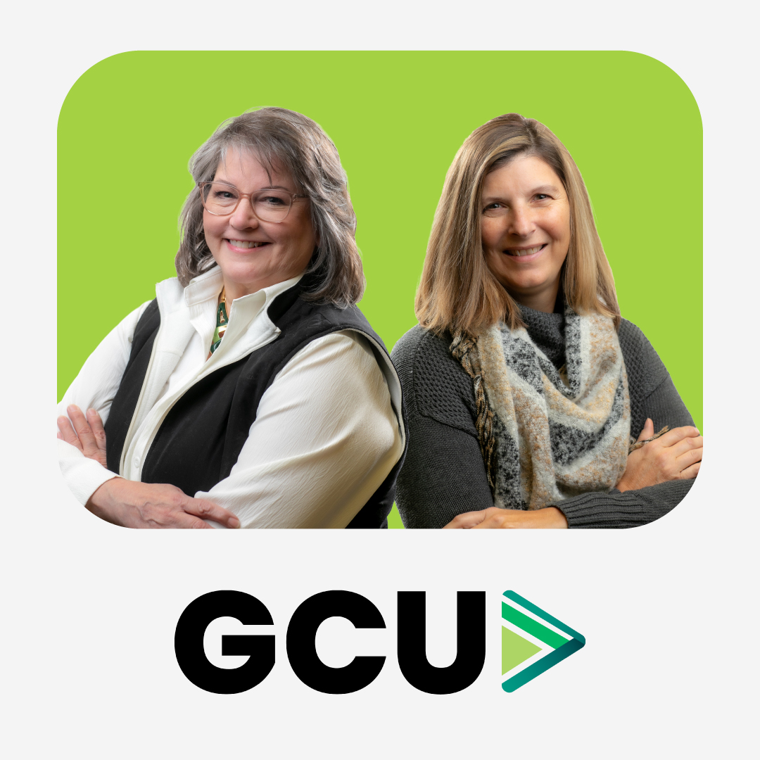 Two smiling training and education directors from Great Clips Inc., Lora and Sue, smile over a green background with the logo for Great Clips University underneath