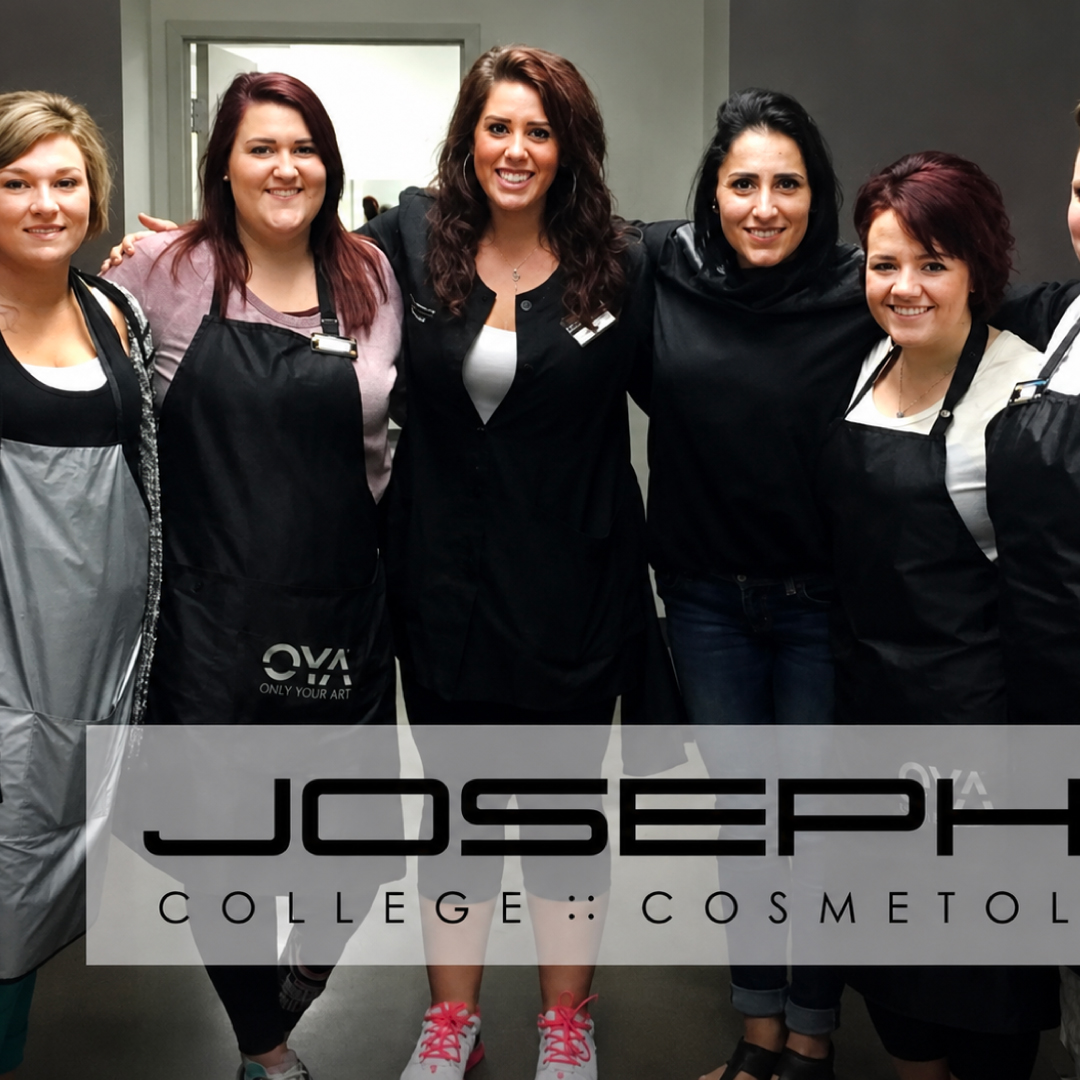 Tasha, center, smiling at her old job as a cosmetology instructor, along with 5 smiling women students.