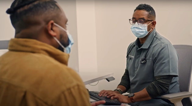 Medical professional with patient