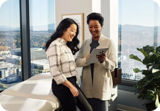 Doctor looking at a tablet with a patient