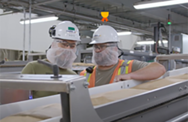 Employees on an assembly line