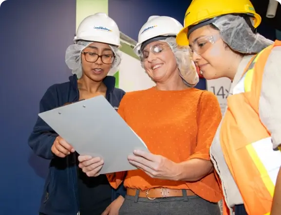 Food service workers looking at a piece of paper