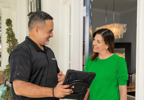 spectrum employee talking to customers at a spectrum store