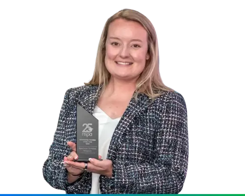 spectrum University Relations Programs manager megan smiling with nspa scholarship award
