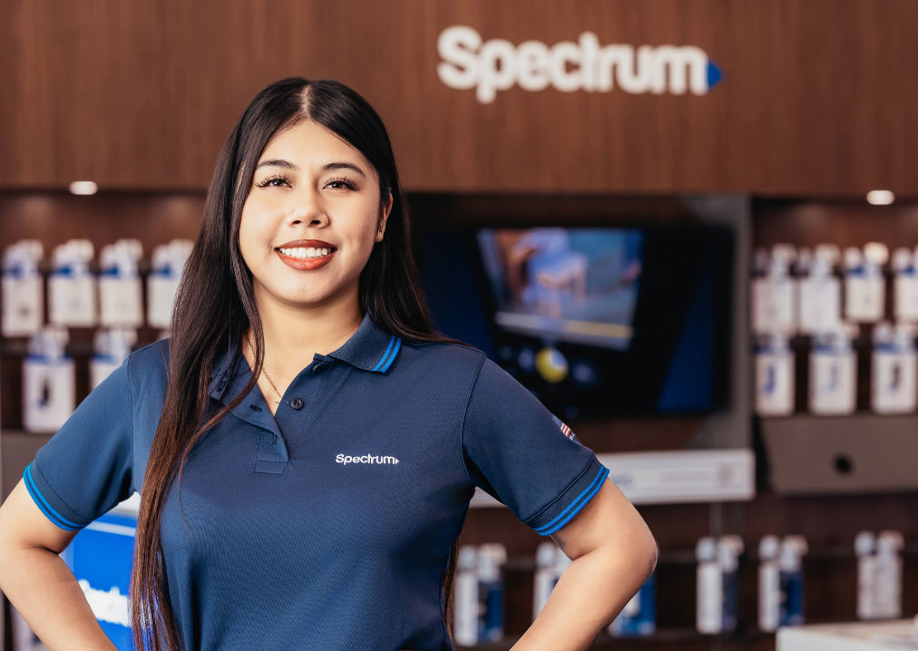 Female retail employee smiling