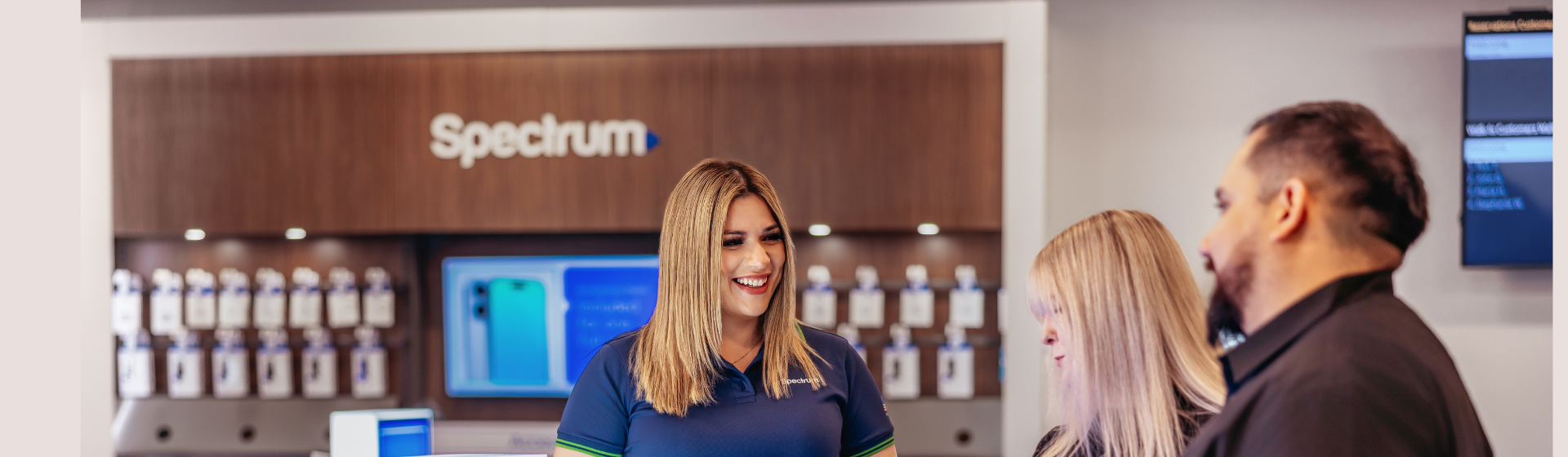 Spectrum employee selling spectrum products to a customer in a spectrum store