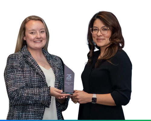 spectrum University Relations team megan and elly smiling with nspa scholarship award