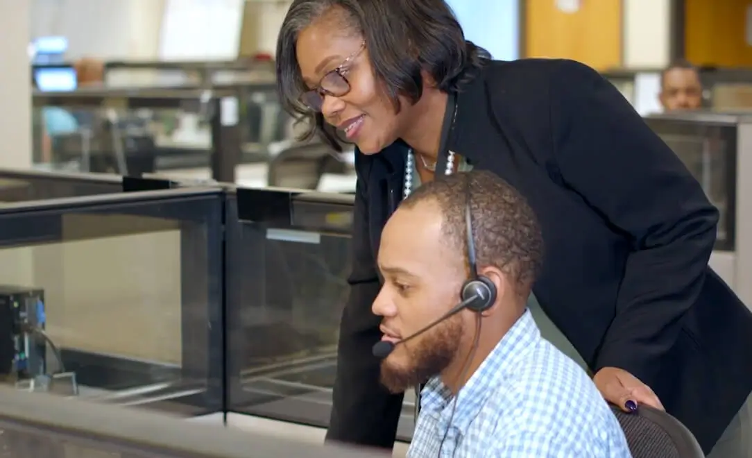 two spectrum employees working together in a spectrum call center