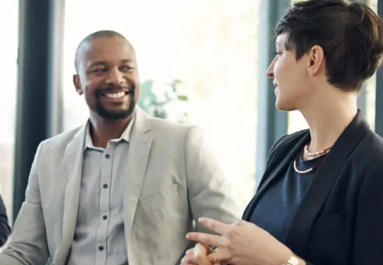 four business professionals meeting in a conference room