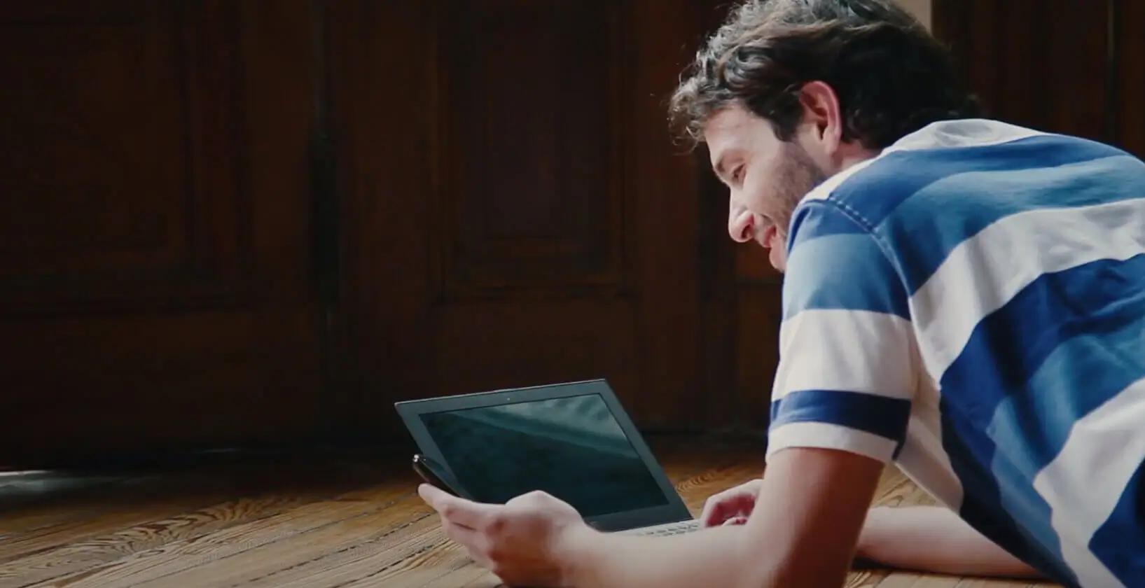 Man on tablet smiling