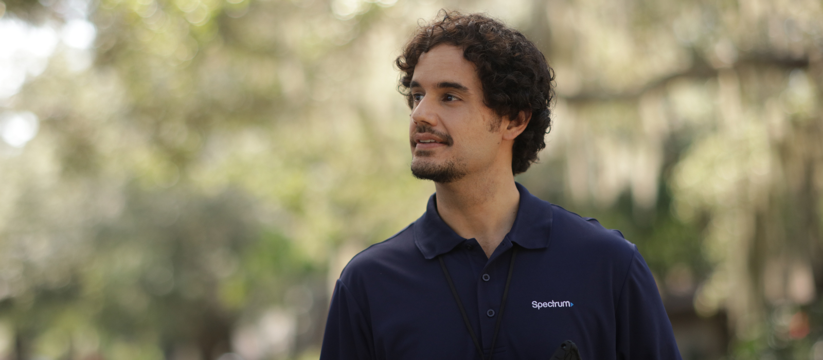 Man looking at home wearing Spectrum uniform