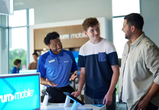 spectrum employee talking to customers at a spectrum store