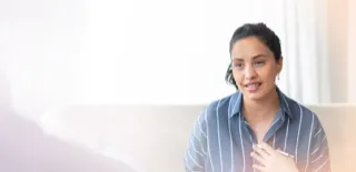 Smiling woman sitting indoors