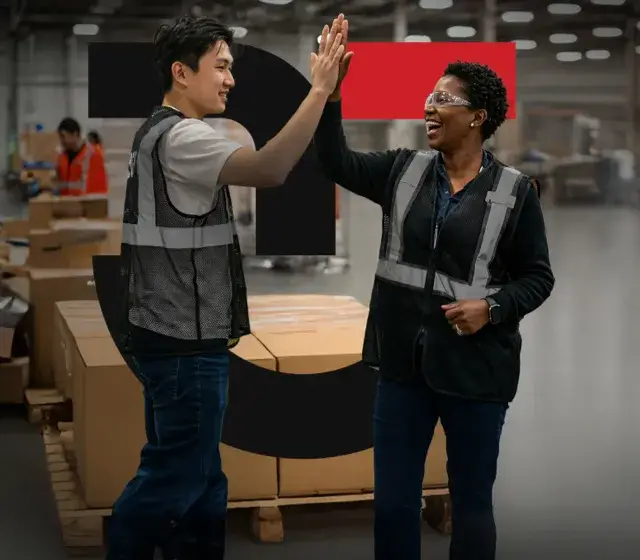 Two people high fiving
