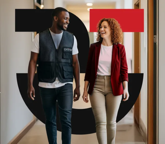 Two OnTrac employees walking down a hallway