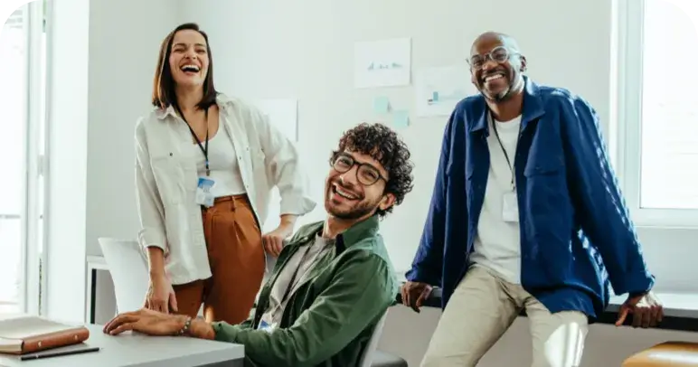 A group of employees laughing together 