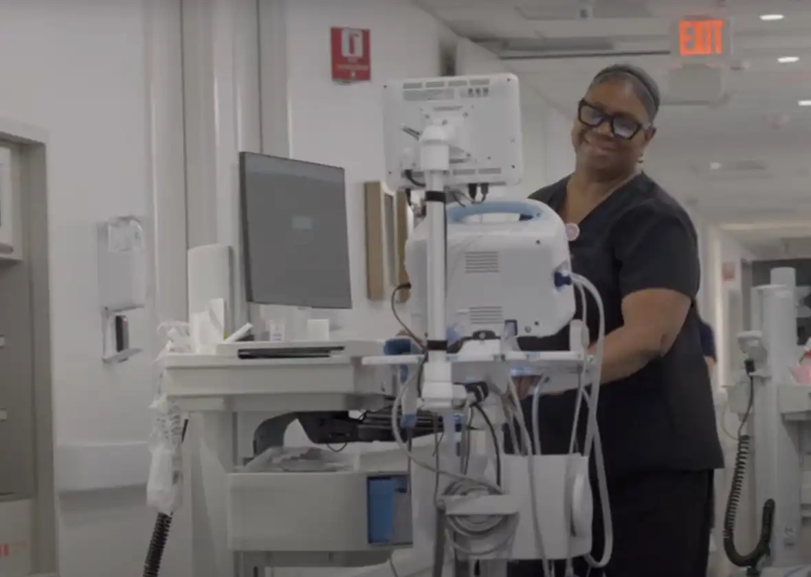 A MLBH employee with medical equipment