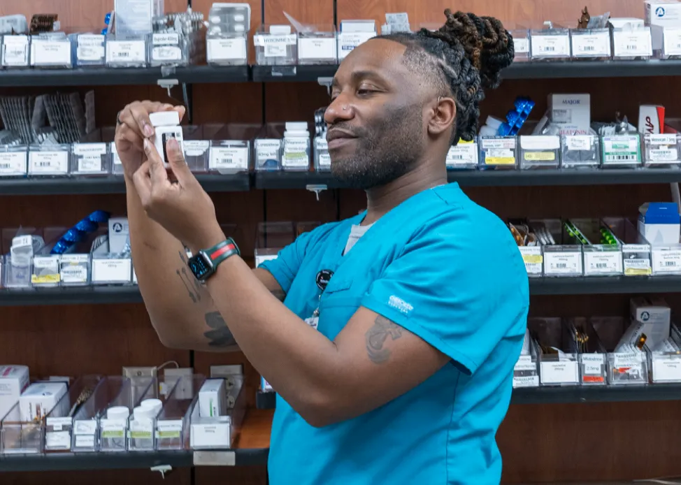 A pharmacy resident verifying a medication
