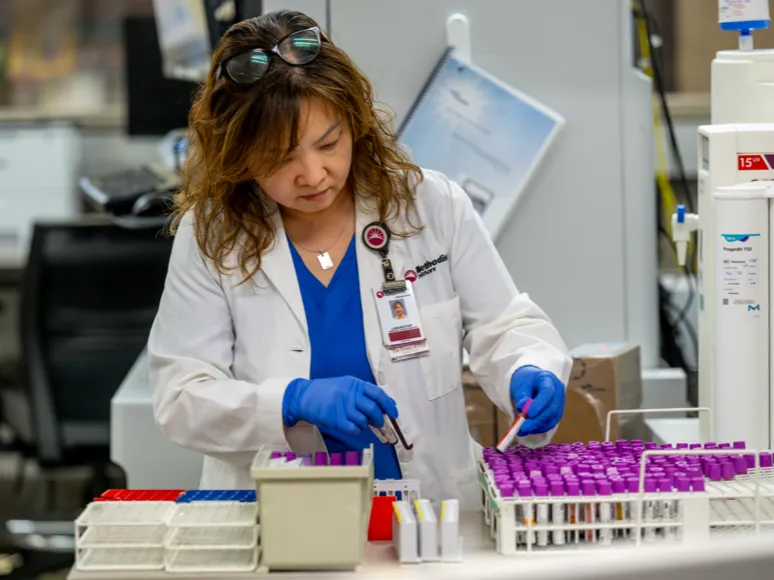 A woman working in a lab setting