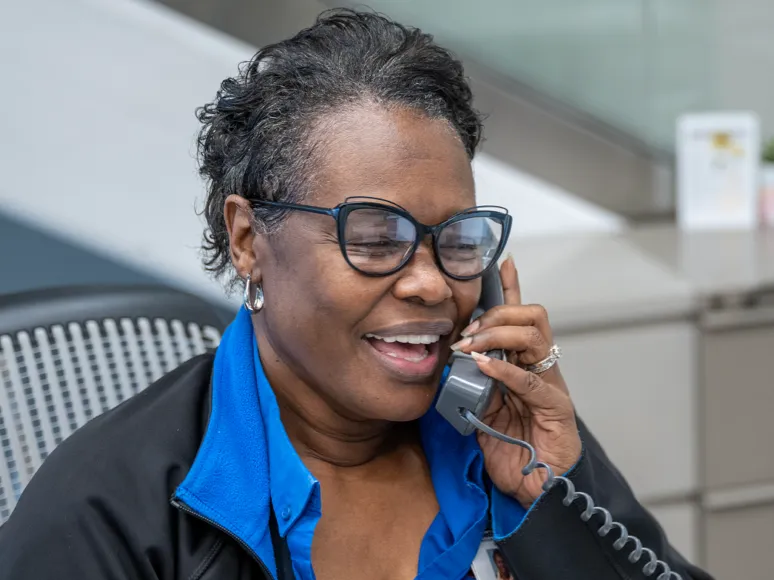 A receptionist talking on the phone