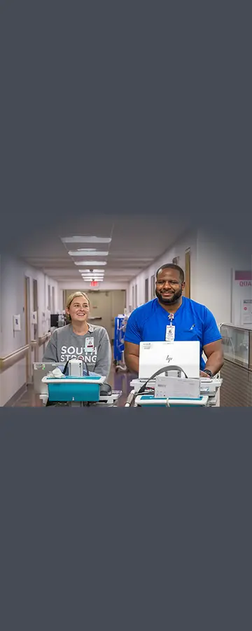 Two nurses with medical equipment